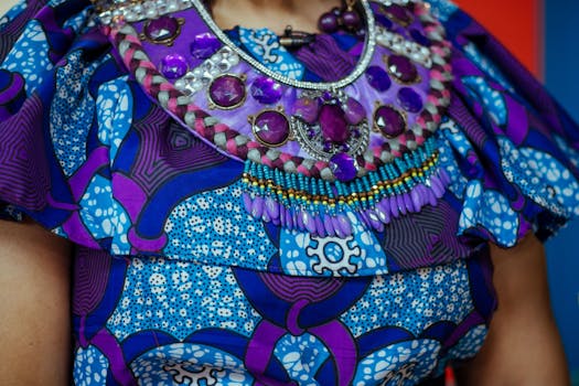 Colorful African attire featuring intricate handmade jewelry with vivid patterns and rich textures.